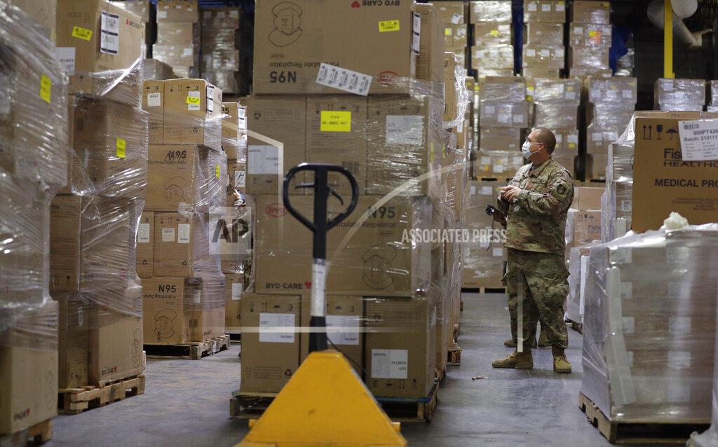 Eric Gay Members of the National Guard work with Personal Protective Equipment during the coronavirus pandemic at a Texas Division of Emergency Management Warehouse, Tuesday, Aug. 4, 2020, in San Antonio. (AP Photo/Eric Gay)