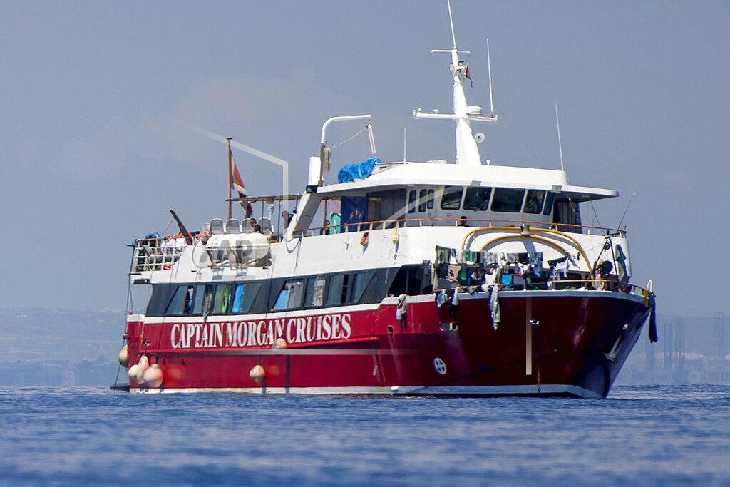 Rene' Rossignaud Migrants dry their clothes aboard a tourist boats some 20 kilometers from Malta, Tuesday, June 2, 2020. More than 400 migrants are living aboard pleasure cruise vessels, bobbing in the sea off Malta, many of them for weeks now. Rescued from human traffickers’ unseaworthy boats in several operations in the central Mediterranean since late April, the migrants, along with the Maltese government, are waiting for European Union countries to offer to take them. (AP Photo/Rene' Rossignaud)