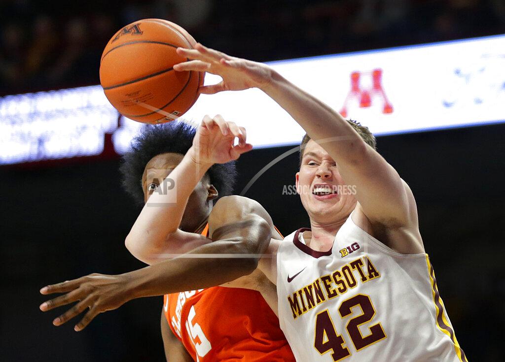 Andy Clayton-King Minnesota forward Michael Hurt (42) and Clemson forward John Newman III (15) battle for a rebound in the second half during an NCAA college basketball game Monday, Dec. 2, 2019, in Minneapolis. (AP Photo/Andy Clayton-King)