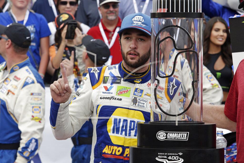Wesley Broome Chase Elliott poses with the trophy after winning the NASCAR Cup Series auto race at Charlotte Motor Speedway in Concord, N.C., Sunday, Sept. 29, 2019. (AP Photo/Wesley Broome)