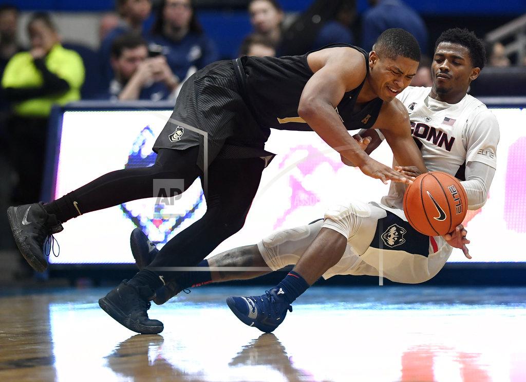 Jessica Hill Connecticut's Alterique Gilbert, right, fouls Central Florida's BJ Taylor during the second half of an NCAA college basketball game, Saturday, Jan. 5, 2019, in Hartford, Conn. (AP Photo/Jessica Hill)