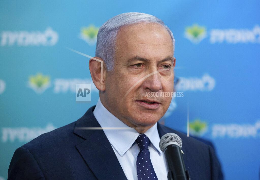 Israeli Prime Minister Benjamin Netanyahu visits the Leumit Health Care Services vaccination facility and meets Theodor Salzen, the 4 millionth person in Israel to be vaccinated for the coronavirus, in Jerusalem, Tuesday, Feb. 16, 2021. (Alex Kolomoisky/Pool via AP)