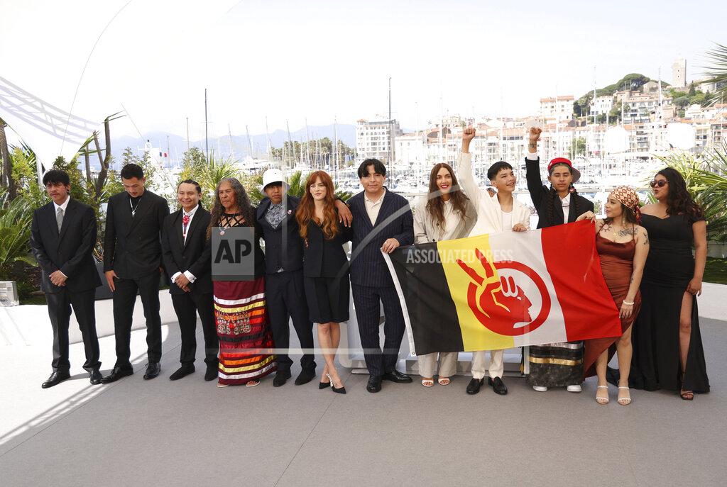 Vianney Le Caer Manual Garcia, from left, Robert Stover Jr , Woodrow Long Elk, Wilma Colhoff, Ta-Yamni Long Black Cat, director Riley Keough, producer Willi White, director Gina Gammell, LaDainian Crazy Thunder, Jessica Poor Bear, Angelic McClung, and Calista Cottier pose for photographers at the photo call for the film 'War Pony' at the 75th international film festival, Cannes, southern France, Saturday, May 21, 2022. (Photo by Vianney Le Caer/Invision/AP)