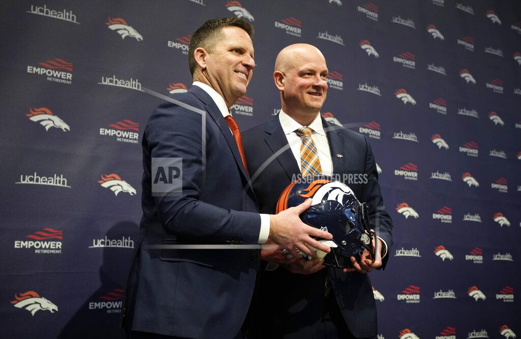 David Zalubowski Denver Broncos general manager George Paton, left, joins new head coach Nathaniel Hackett for a photo after a news conference to introduce Hackett, Friday, Jan. 28, 2022, at the NFL football team's headquarters in Englewood, Colo. (AP Photo/David Zalubowski)
