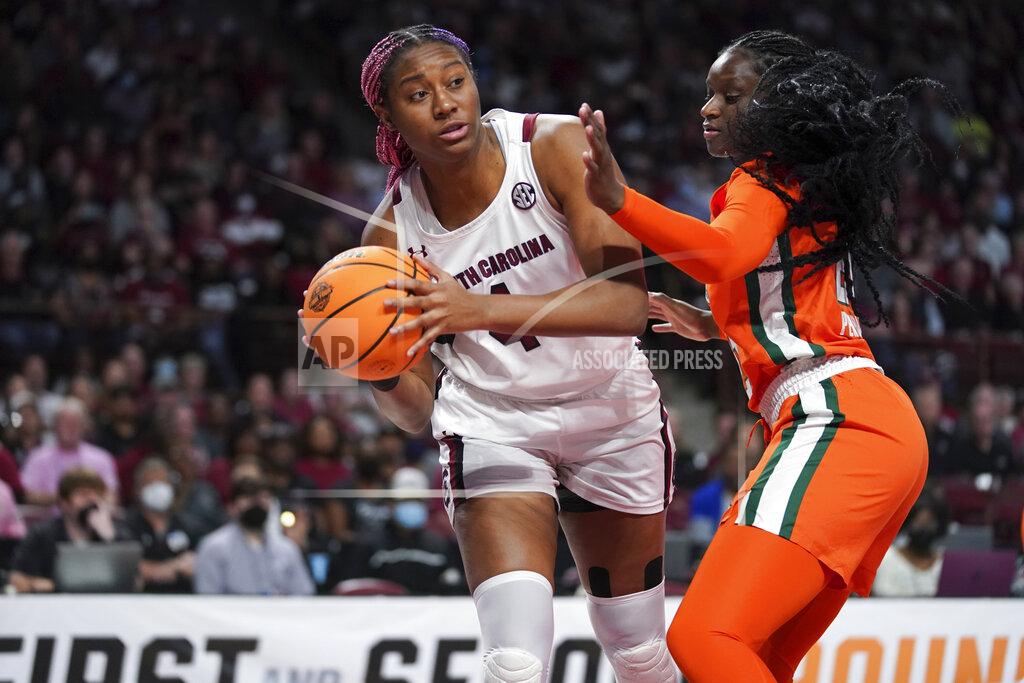Sean Rayford South Carolina forward Aliyah Boston (4) looks to pass the ball around Miami forward Lola Pendande right, during the first half a second-round game in the NCAA college basketball tournament, Sunday, March 20, 2022, in Columbia, S.C. (AP Photo/Sean Rayford)