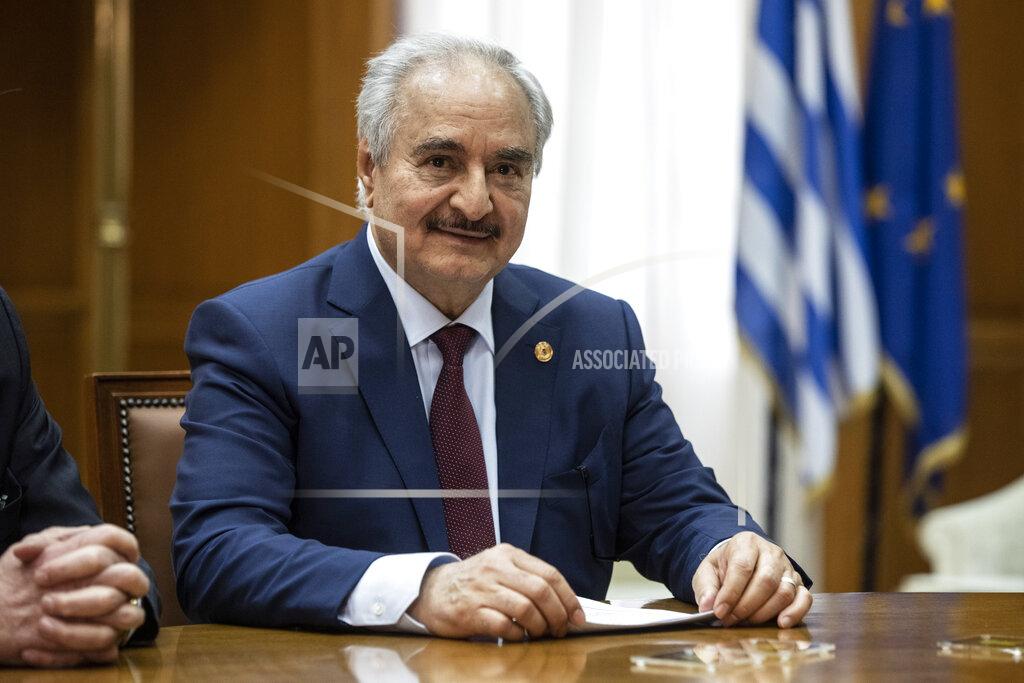 Libyan Gen. Khalifa Hifter looks on during his meeting with Greek Prime Minister Kyriakos Mitsotakis, in Athens, Friday, Jan. 17, 2020. The commander of anti-government forces in war-torn Libya has begun meetings in Athens in a bid to counter Turkey's support for his opponents. (AP Photo/Petros Giannakouris)