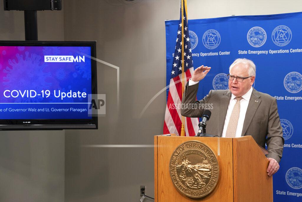 Glen Stubbe Minnesota Gov. Tim Walz announces new guidelines today for restaurants, bars, salons and barber shops during the coronavirus pandemic Wednesday, May 20, 2020. Restaurants and bars may reopen June 1 for outdoor dining with social distancing and other safeguards in place, while salons and barbershops will also be allowed to resume business at partial capacity. (Glen Stubbe/Star Tribune via AP)