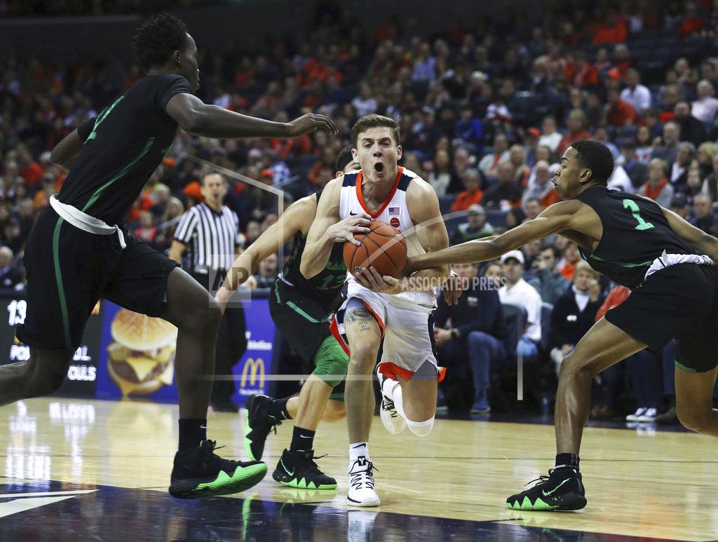 Zack Wajsgras Virginia's guard Kyle Guy (5) is caught between three Marshall defenders in the first half of an NCAA college basketball game on Monday, Dec. 31, 2018, in Charlottesville, Va. (AP Photo/Zack Wajsgras)