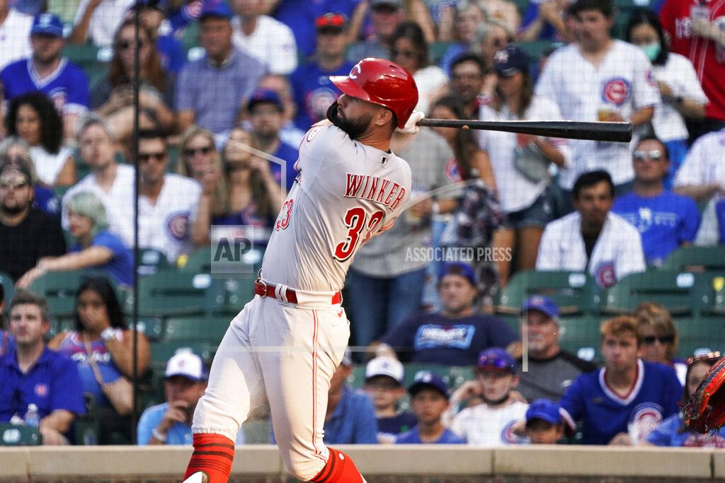David Banks Cincinnati Reds' Jesse Winker watches his home run against the Chicago Cubs during the first inning of a baseball game Tuesday, July 27, 2021, in Chicago. (AP Photo/David Banks)