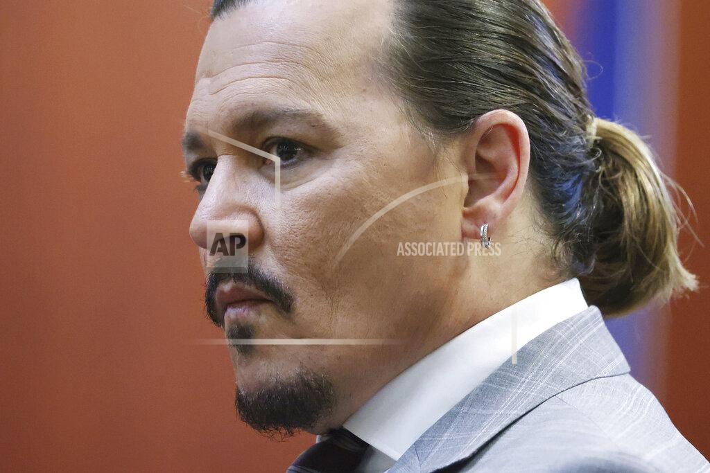 Michael Reynolds Actor Johnny Depp arrives in the courtroom in the Fairfax County Circuit Courthouse in Fairfax, Va., Thursday, May 26, 2022. Actor Johnny Depp sued his ex-wife Amber Heard for libel in Fairfax County Circuit Court after she wrote an op-ed piece in The Washington Post in 2018 referring to herself as a "public figure representing domestic abuse." (Michael Reynolds/Pool Photo via AP)
