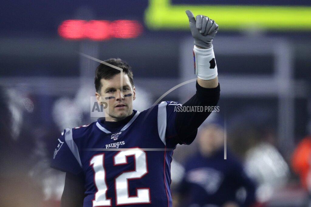 Charles Krupa FILE - In this Jan. 4, 2020, file photo, New England Patriots quarterback Tom Brady gestures to a teammate before an NFL wild-card playoff football game against the Tennessee Titans in Foxborough, Mass. A highlight of the opening weekend of the NFL season will have Brady's regular-season debut with Tampa Bay against Drew Brees at New Orleans on Sept. 13 — the first matchup of 40-plus quarterbacks in NFL history. (AP Photo/Charles Krupa, File)