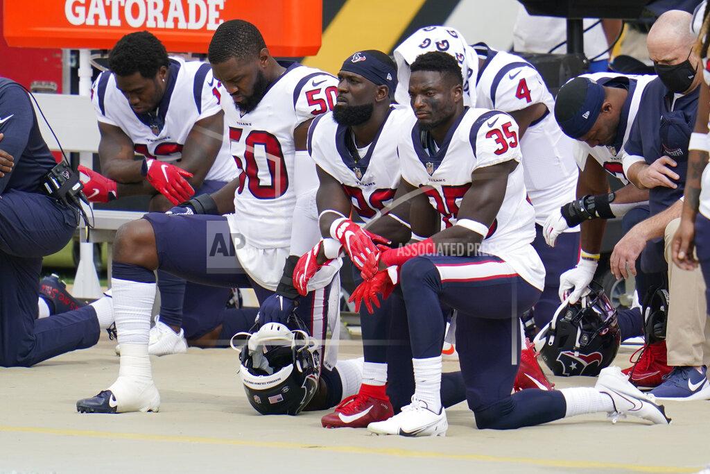 Gene J. Puskar Some of the Houston Texans kneel as others stand for the playing of the National Anthem before an NFL football game against the Pittsburgh Steelers, Sunday, Sept. 27, 2020, in Pittsburgh. (AP Photo/Gene J. Puskar)
