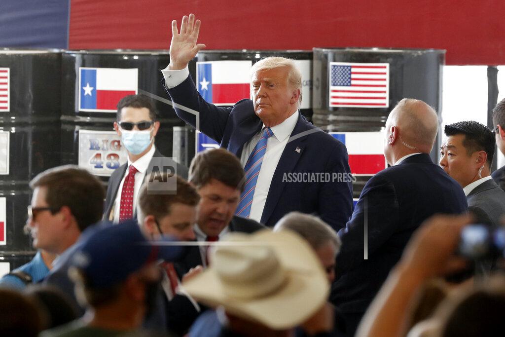 Tony Gutierrez President Donald Trump waves to supporters after delivering remarks about American energy production during a visit to the Double Eagle Energy Oil Rig, Wednesday, July 29, 2020, in Midland, Texas. (AP Photo/Tony Gutierrez)