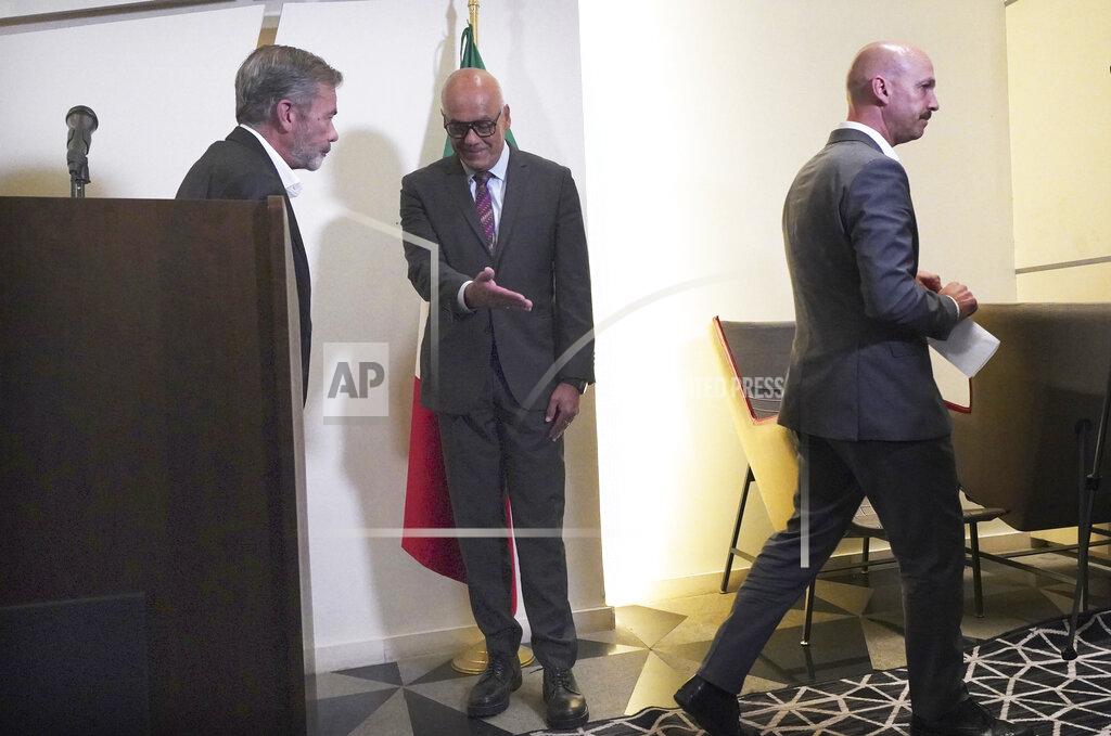 Marco Ugarte Norwegian diplomat Dan Nylander, right, Venezuelan opposition delegate Gerardo Blyde Perez, left, and President of the National Assembly of Venezuela, Jorge Rodriguez, center, exit a press conference in Mexico City, Monday Sept. 27, 2021. Delegates from Venezuela’s government and opposition held more talks in Mexico City on Monday after a delay that saw the government’s side arrive a day later than scheduled due to an apparent unhappiness with mediator Norway. (AP Photo/Marco Ugarte)