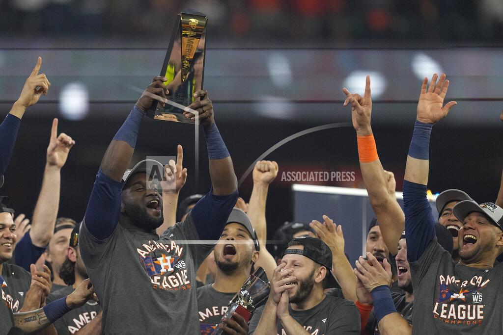 Tony Gutierrez Houston Astros designated hitter Yordan Alvarez holds the trophy after their win against the Boston Red Sox in Game 6 of baseball's American League Championship Series Friday, Oct. 22, 2021, in Houston. The Astros won 5-0, to win the ALCS series in game six. (AP Photo/Tony Gutierrez)
