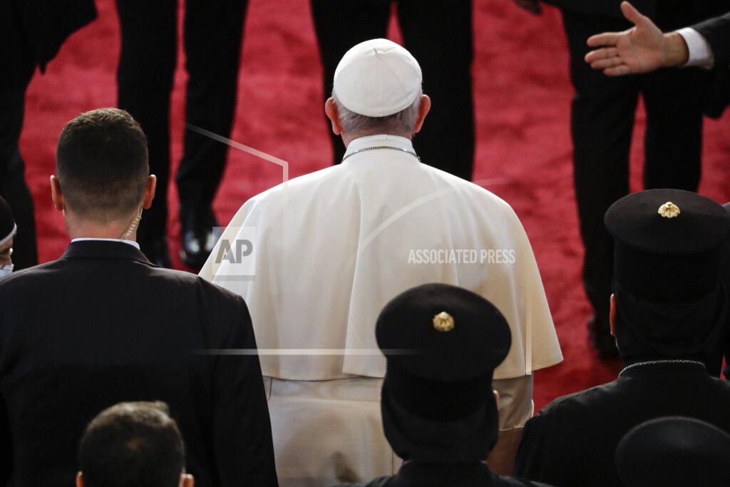 Andrew Medichini Pope Francis arrives at the Sayidat al-Nejat (Our Lady of Salvation) Cathedral, in Baghdad, Iraq, Friday, March 5, 2021. Pope Francis has arrived in Iraq to urge the country's dwindling number of Christians to stay put and help rebuild the country after years of war and persecution, brushing aside the coronavirus pandemic and security concerns. (AP Photo/Andrew Medichini)