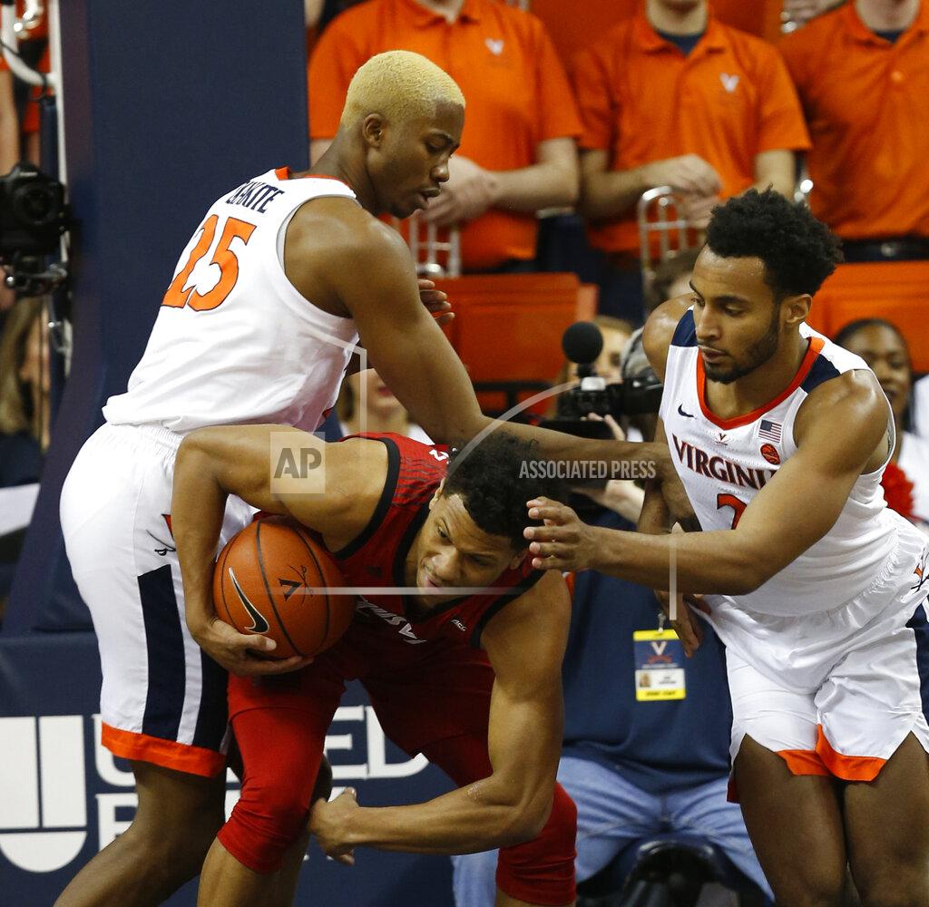 Steve Helber Louisville forward Dwayne Sutton, bottom, battles for a rebound with Virginia forward Mamadi Diakite (25) and Virginia guard Braxton Key (2) during the first half of an NCAA college basketball game in Charlottesville, Va., Saturday, March 9, 2019. (AP Photo/Steve Helber)