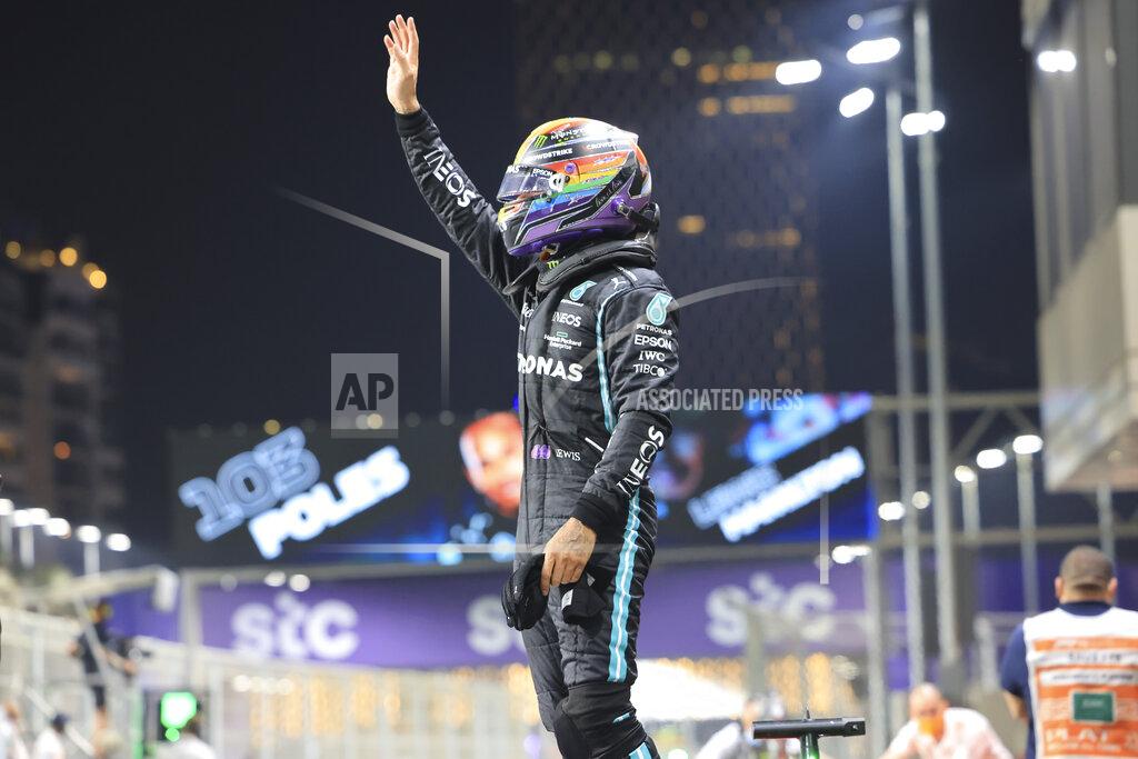 Giuseppe Cacace Mercedes driver Lewis Hamilton of Britain celebrates after winning pole position for the Formula One Saudi Arabian Grand Prix in Jiddah, Saturday, Dec. 4, 2021.(Giuseppe Cacace, Pool via AP)