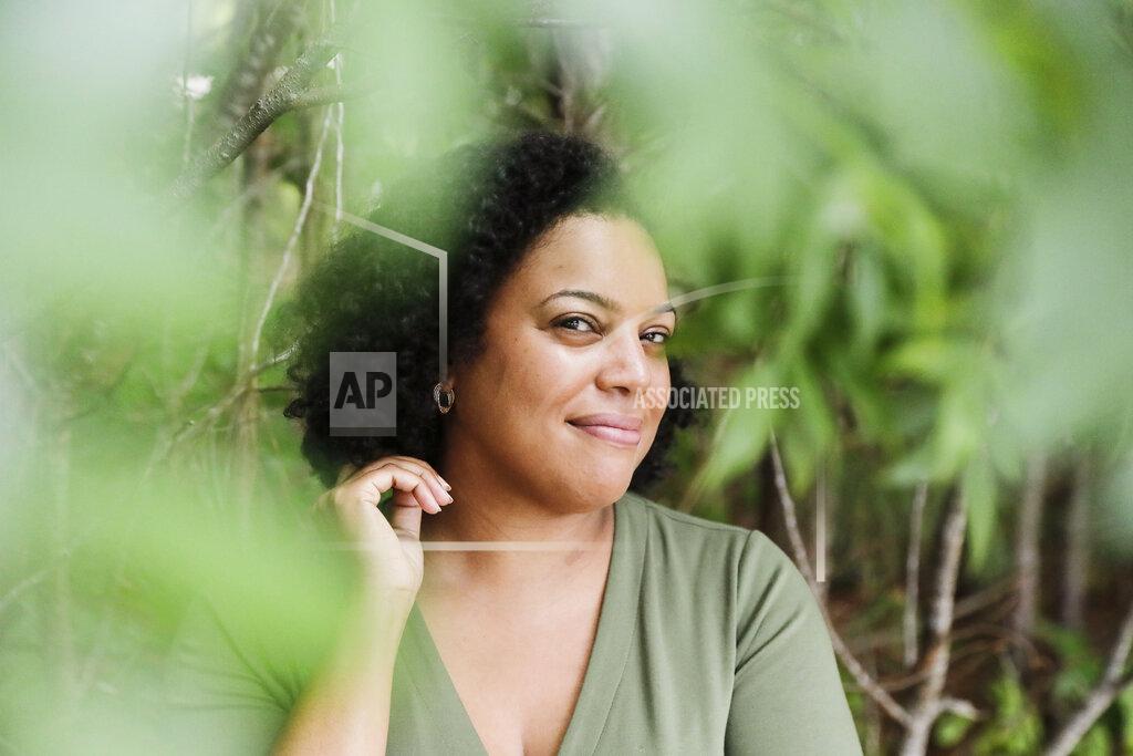 Brynn Anderson Charisse Davis poses for a portrait on Friday, July 24, 2020, in Marietta, Ga. Davis was recently elected the only Black woman on the Cobb County School Board. "We've been watching from the sidelines and allowing other people to take their turns, and take these positions of power," Davis said. "Now here we are to essentially fix it." (AP Photo/Brynn Anderson)