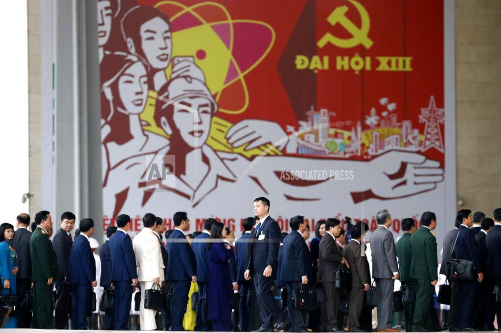 Minh Hoang Delegates arrive at the national convention center to attend the 13th Communist Party Congress in Hanoi, Vietnam Tuesday, Jan. 26, 2021. Vietnam's ruling Communist Party has begun a crucial weeklong meeting in the capital Hanoi to set the nation's path for the next five years and appoint the country's top leaders. (AP Photo/Minh Hoang)
