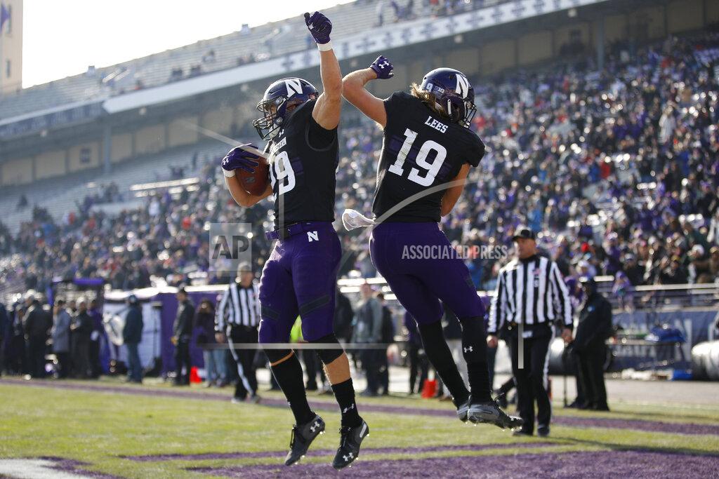 Jim Young Northwestern's Tyler Haskin, left, celebrates his touchdown against Massachusetts with teammate Riley Lees during the first half of an NCAA college football game Saturday, Nov. 16, 2019, in Evanston, Ill. (AP Photo/Jim Young)