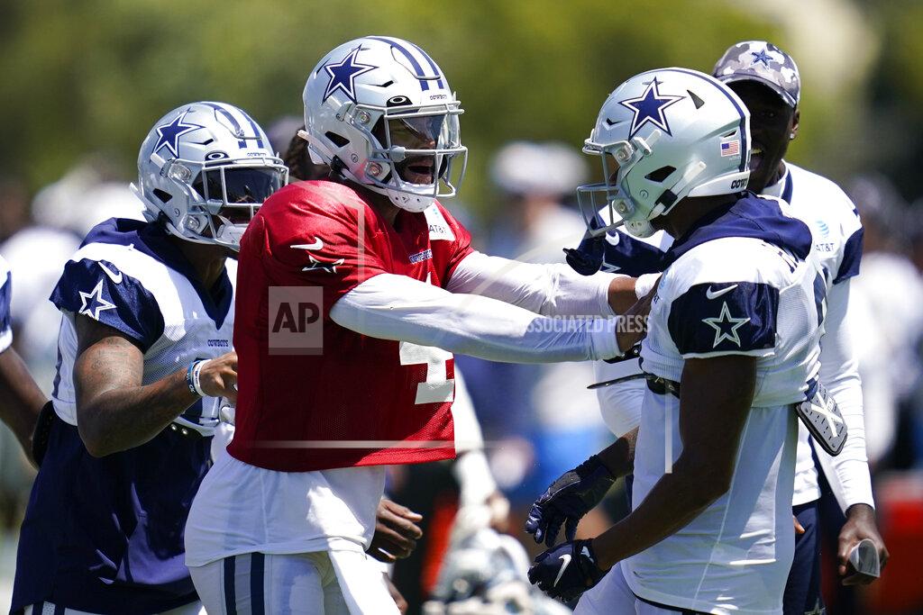 Ashley Landis Dallas Cowboys quarterback Dak Prescott (4) and wide receiver Dennis Houston (3) participate in drills during a combined NFL practice at the Los Angeles Rams' practice facility in Costa Mesa, Calif. Thursday, Aug. 18, 2022. (AP Photo/Ashley Landis)