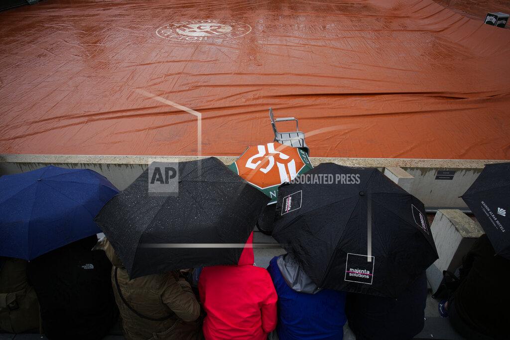 Christophe Ena Rain suspended first round matches at the French Open tennis tournament in Roland Garros stadium in Paris, France, Monday, May 23, 2022. (AP Photo/Christophe Ena)
