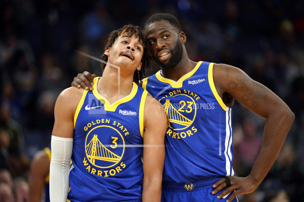 Brandon Dill FILE - In this Nov. 19, 2019, file photo, Golden State Warriors guard Jordan Poole (3) and forward Draymond Green (23) talk during a break in the first half of an NBA basketball game against the Memphis Grizzlies in Memphis, Tenn. (AP Photo/Brandon Dill, File)