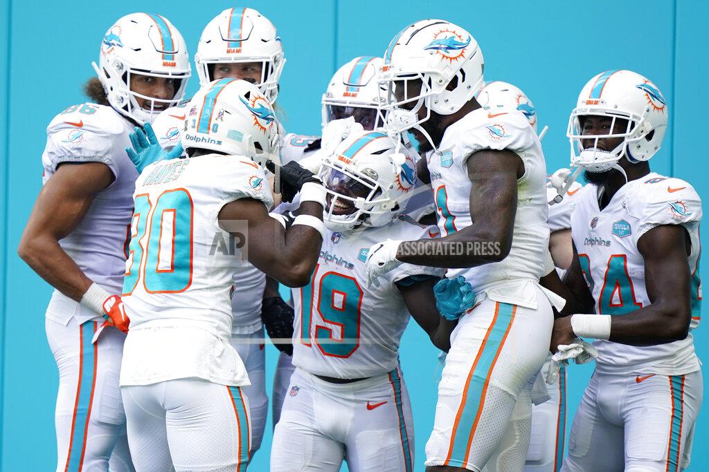 Wilfredo Lee Teammates congratulate Miami Dolphins wide receiver Jakeem Grant (19) after Grant scored a touchdown, during the first half of an NFL football game against the Los Angeles Rams, Sunday, Nov. 1, 2020, in Miami Gardens, Fla. (AP Photo/Wilfredo Lee)