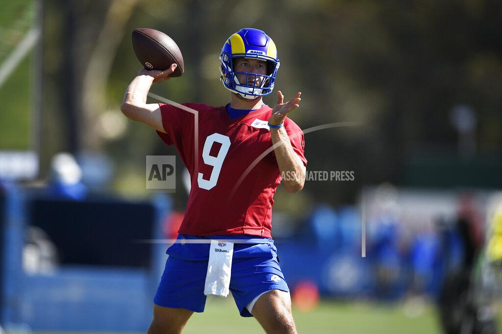 Los Angeles Rams quarterback Matthew Stafford throws a pass during NFL football training camp practice in Irvine, Calif., Saturday, July 31, 2021. (AP Photo/Kelvin Kuo)