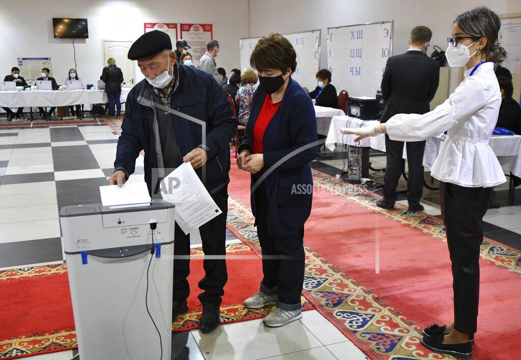Vladimir Voronin A man casts his ballot at a polling station during the referendum in Bishkek, Kyrgyzstan, Sunday, April 11, 2021. Voters in Kyrgyzstan cast ballots Sunday on whether to approve a new constitution that would substantially increase the president's powers. The Sunday referendum comes three months after Sadyr Zhaparov was elected president, following the ouster of the previous president amid protests, the third time in 15 years that a leader of the Central Asian country had been driven from office in a popular uprising. (AP Photo/Vladimir Voronin)