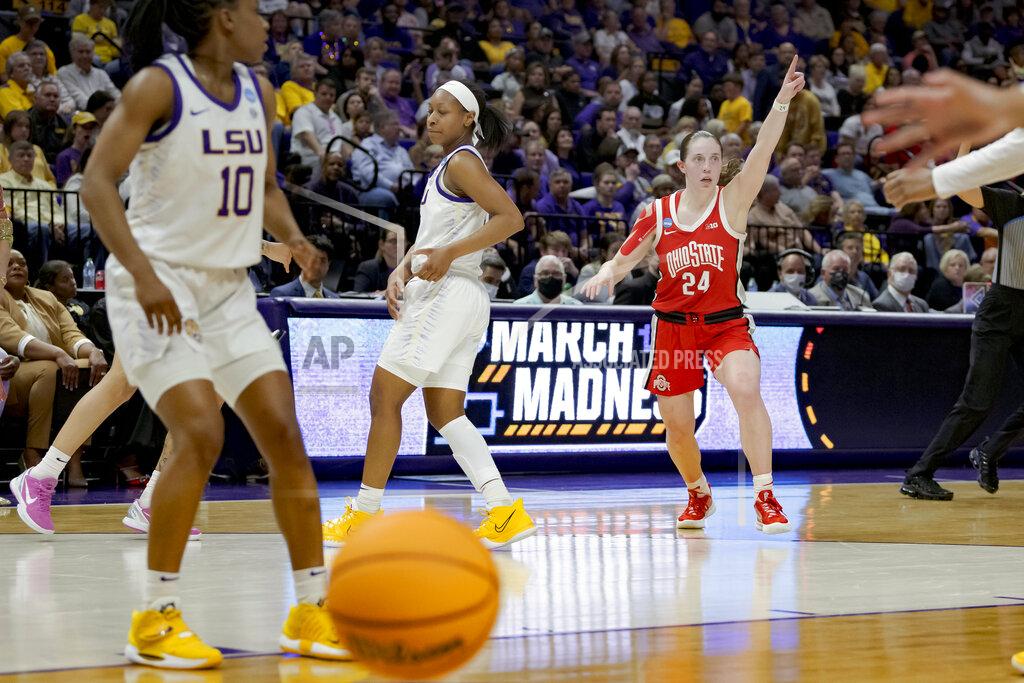 Matthew Hinton Ohio State guard Taylor Mikesell (24) points to the scoreboard after making a 3-point basket against LSU during the first half of a college basketball game in the second round of the NCAA tournament, Monday, March 21, 2022, in Baton Rouge, La. (AP Photo/Matthew Hinton)