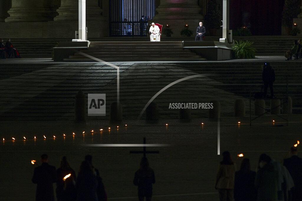 Angelo Carconi Pope Francis leads the Via Crucis (Way of the Cross) procession in the empty square outside the Saint Peter's Basilica during Good Friday celebrations at the Vatican, with no public participation due to the Coronavirus pandemic, Friday, April 2, 2021. (Angelo Carconi/Pool photo via AP)