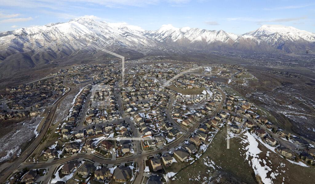 Rick Bowmer FILE - Rows of homes, in suburban Salt Lake City, on April 13, 2019. Utah is one of two Western states known for rugged landscapes and wide-open spaces that are bucking the trend of sluggish U.S. population growth. The boom there and in Idaho are accompanied by healthy economic expansion, but also concern about strain on infrastructure and soaring housing prices. (AP Photo/Rick Bowmer, File)