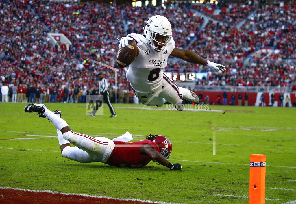 Butch Dill Mississippi State running back Kylin Hill (8) dives over Alabama defensive back Shyheim Carter (5) for the end zone, but the play was called back for a penalty during the first half of an NCAA college football game, Saturday, Nov. 10, 2018, in Tuscaloosa, Ala. (AP Photo/Butch Dill)