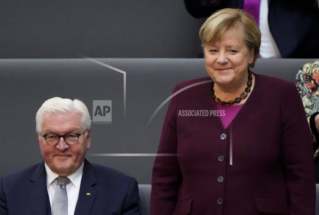 Markus Schreiber German Chancellor Angela Merkel stands next to German President Frank-Walter Steinmeier during the first plenary session of the German parliament Bundestag after the elections, Berlin, Tuesday, Oct. 26, 2021. (Photo/Markus Schreiber)