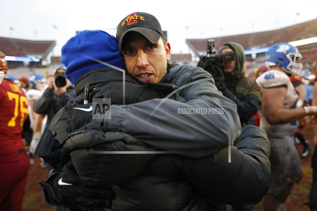 Charlie Neibergall Drake head coach Rick Fox, left, gets a hug from Iowa State head coach Matt Campbell after an NCAA college football game, Saturday, Dec. 1, 2018, in Ames, Iowa. Iowa State won 27-24. (AP Photo/Charlie Neibergall)