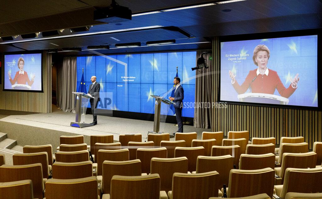 Olivier Matthys European Council President Charles Michel, left, speaks during a media conference after an EU-Western Balkans videoconference summit at the EU Council building in Brussels, Wednesday, May 6, 2020. European Union leaders sought Wednesday to reassure their counterparts from six Balkans countries that the bloc remains the volatile region's most important partner, particularly as the coronavirus hits their societies, ravaging health care systems and economies. (AP Photo/Olivier Matthys, Pool)
