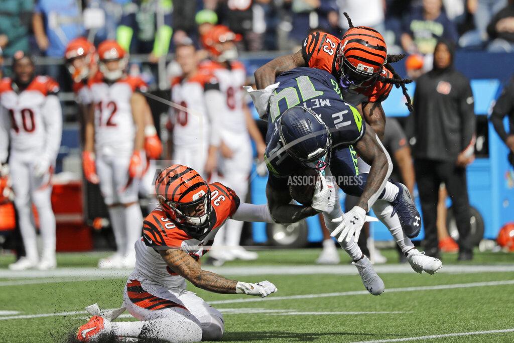 John Froschauer Seattle Seahawks wide receiver DK Metcalf (14) is tackled by Cincinnati Bengals cornerback B.W. Webb (23) and free safety Jessie Bates (30) after Metcalf made a catch during the second half of an NFL football game Sunday, Sept. 8, 2019, in Seattle. (AP Photo/John Froschauer)