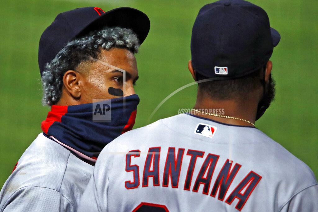 Gene J. Puskar Cleveland Indians' Francisco Lindor, left, talks with Carlos Santana before taking the field for the eighth inning of a baseball game against the Pittsburgh Pirates in Pittsburgh, Thursday, Aug. 20, 2020. (AP Photo/Gene J. Puskar)