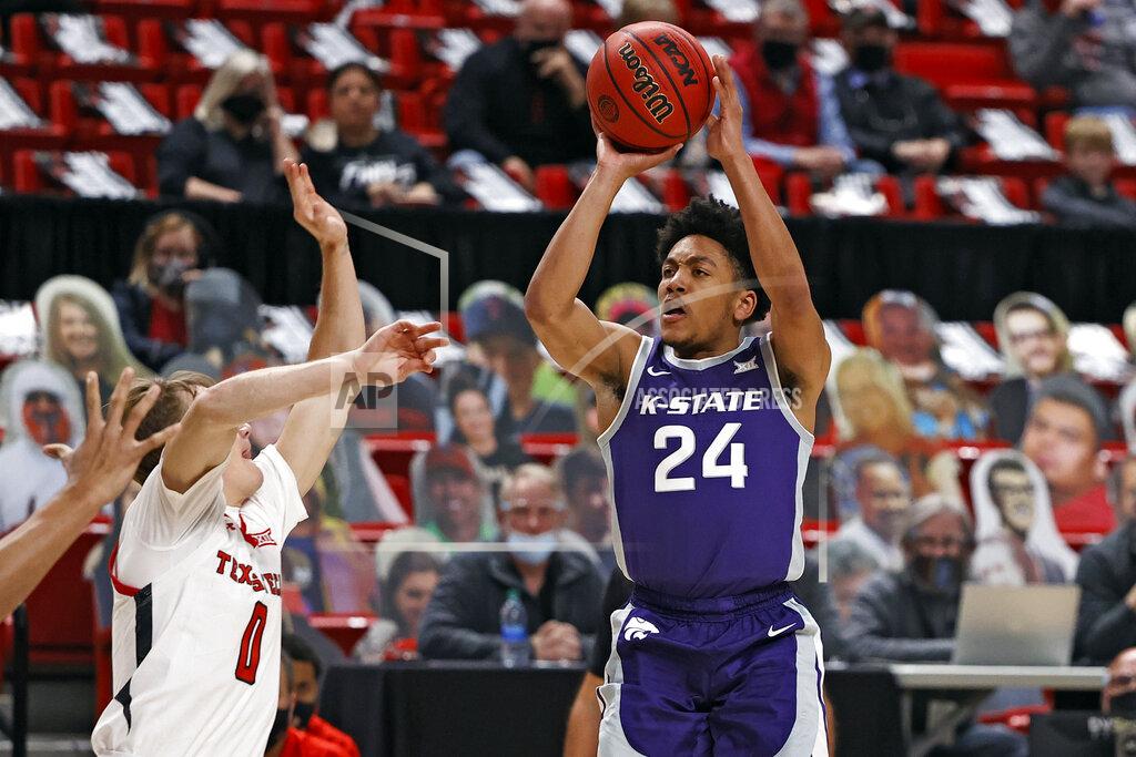 Brad Tollefson Kansas State's Nijel Pack (24) shoots over Texas Tech's Mac McClung (0) during the first half of an NCAA college basketball game Tuesday, Jan. 5, 2021, in Lubbock, Texas. (AP Photo/Brad Tollefson)