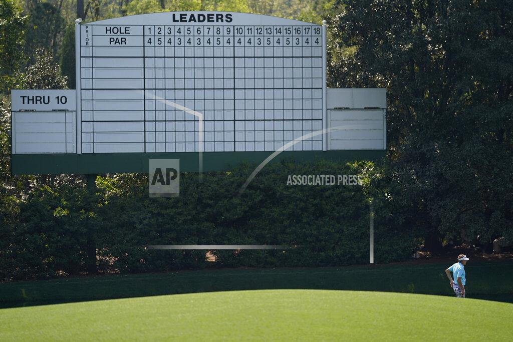 David J. Phillip Ian Poulter, of England, waits to putt on the 11th hole during a practice round for the Masters golf tournament on Wednesday, April 7, 2021, in Augusta, Ga. (AP Photo/David J. Phillip)