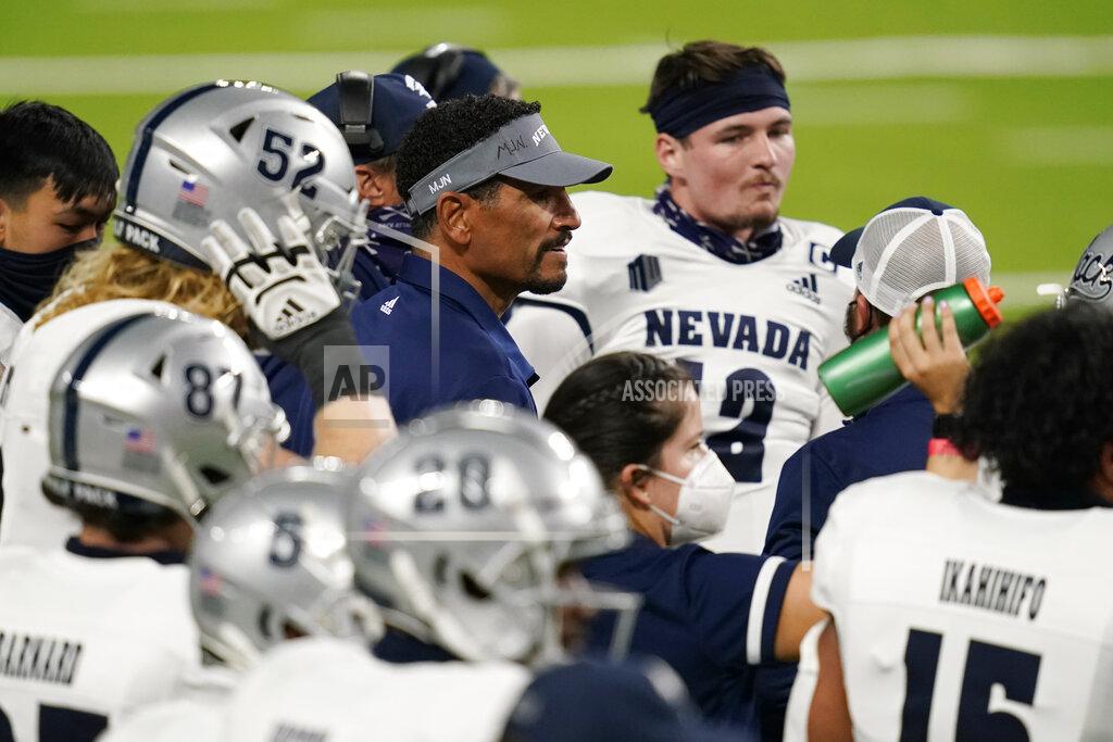 John Locher Nevada coach Jay Norvell speaks with players during the first half of an NCAA college football game against UNLV, Saturday, Oct. 31, 2020, in Las Vegas. (AP Photo/John Locher)