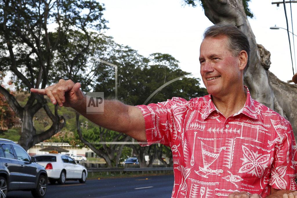 Audrey Mcavoy FILE - In this July 24, 2018, file photo, Ed Case greets evening commuters while campaigning for the U.S. congressional seat representing urban Honolulu, in Honolulu. Races for two seats in Congress top the ballot on Tuesday, Nov. 3, 2020, in Hawaii. Incumbent Democratic U.S. Rep. Ed Case faces Republican Ron Curtis. Case was first elected to the seat two years ago. He previously represented Hawaii's other seat in Congress from 2002 to 2007. (AP Photo/Audrey McAvoy, File)