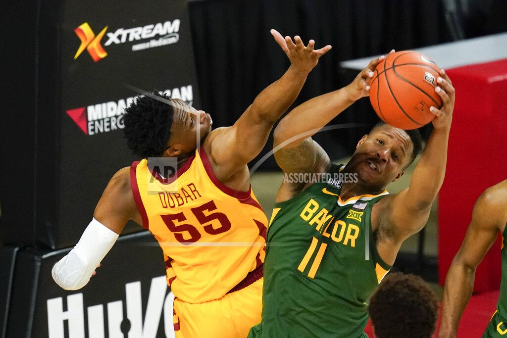 Charlie Neibergall Baylor guard Mark Vital (11) fights for a rebound with Iowa State guard Darlinstone Dubar (55) during the first half of an NCAA college basketball game, Saturday, Jan. 2, 2021, in Ames, Iowa. (AP Photo/Charlie Neibergall)
