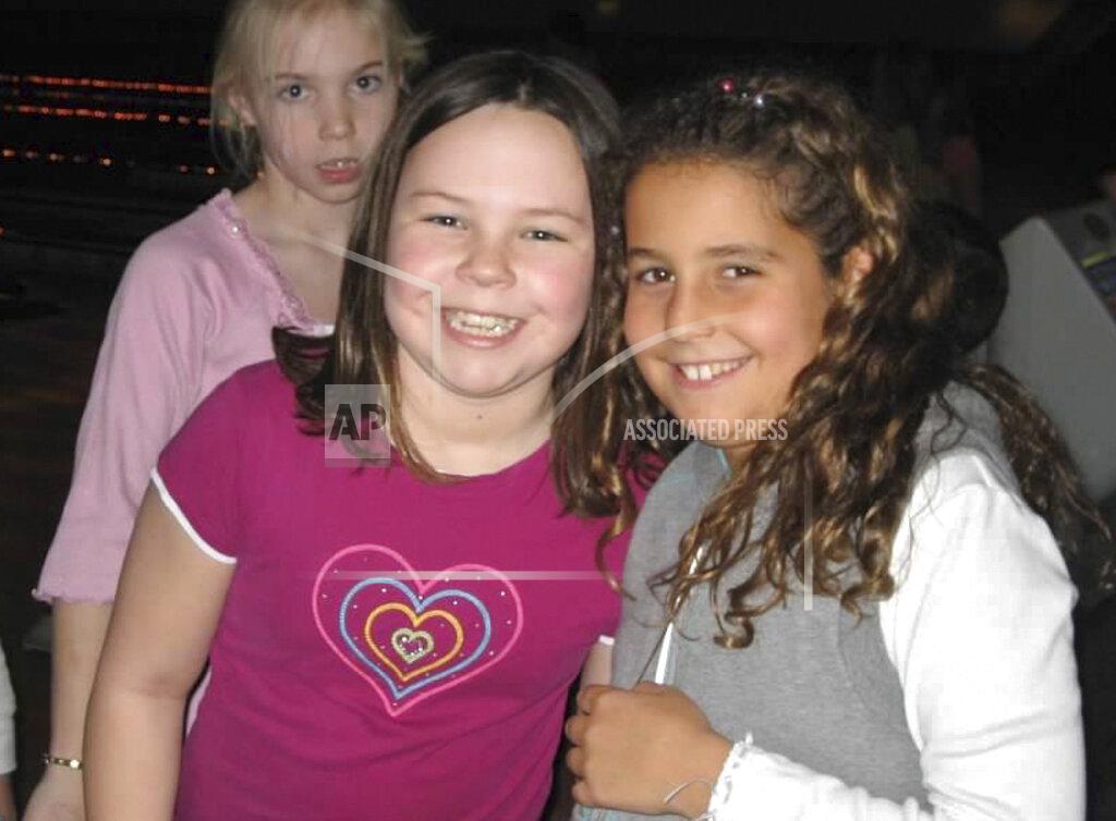 In this 2007 photo provided by the Mann family, nine-year-olds Katelyn Mann, front left and Bryana Cielo pose for a photo at Boonton Lanes Bowling in Boonton, N.J. In March, Mann, who wants to become a nurse, received the Hartford HealthCare Courage award, given each month to one male and one female state athlete who have overcome personal adversity. This month, the award went to Cielo. (Mann Family Photo via AP)