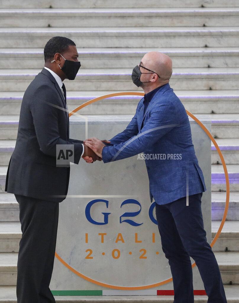 Salvatore Laporta Administrator of the Environmental Protection Agency Michael Stanley Regan, left, is welcomed by Italian Minister for Ecological Transition Roberto Cingolani as he arrives at Palazzo Reale in Naples, Italy, Thursday, July 22, 2021, to take part in a G20 meeting on environment, climate and energy. (AP Photo/Salvatore Laporta)