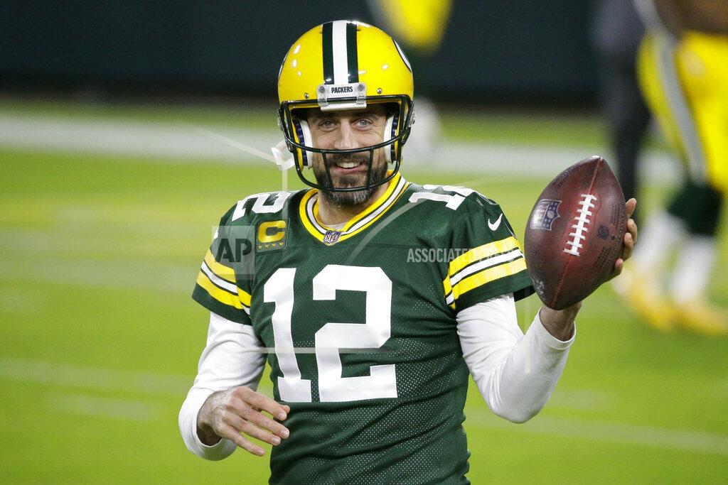 Mike Roemer FILE - Green Bay Packers' Aaron Rodgers warms up before an NFL football game against the Chicago Bears in Green Bay, Wis., in this Sunday, Nov. 29, 2020, file photo. Rodgers is one of 32 players nominated for the seventh annual Art Rooney Sportsmanship Award, the NFL announced Thursday, Dec. 3, 2020. (AP Photo/Mike Roemer, File)