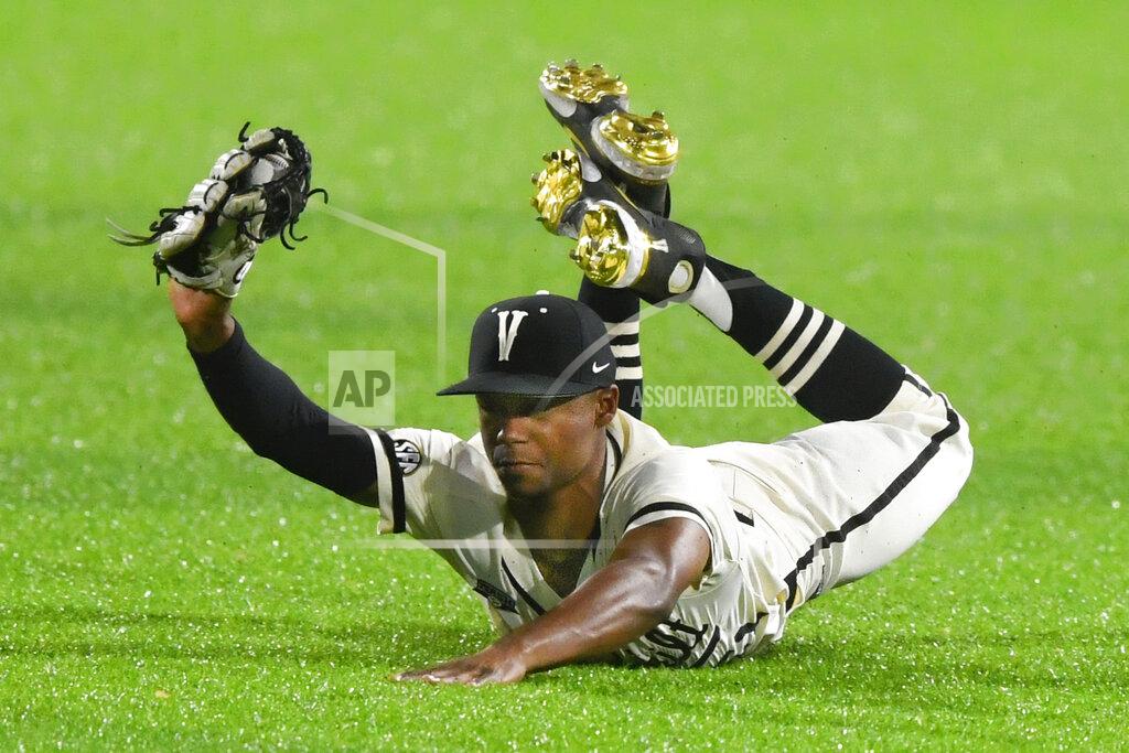 John Amis FILE -Vanderbilt's Enrique Bradfield Jr. makes a diving catch in the outfield to get out Eastern Kentucky's Brycen Collins during an NCAA college baseball game on Tuesday, April 13, 2021, in Nashville, Tenn. Bradfield went into Tuesday, May 24, 2022, 42 for 42 stealing bases this season and had swiped 47 in a row since he was caught trying to steal third against Arkansas last May 27. Bradfield's consecutive steals streak is the longest in at least a decade, according to NCAA records.(AP Photo/John Amis, File)