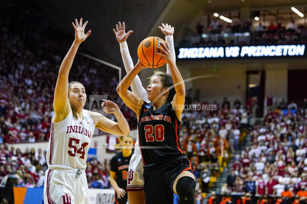 Michael Conroy Princeton guard Kaitlyn Chen (20) shoots over Indiana forward Mackenzie Holmes (54) in the first half of a college basketball game in the second round of the NCAA tournament in Bloomington, Ind., Monday, March 21, 2022. (AP Photo/Michael Conroy)